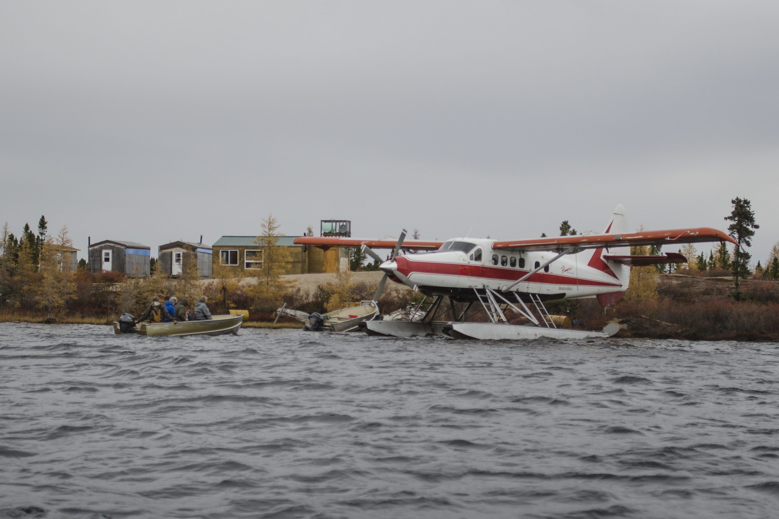 landscape image of Courage Lake Outpost with a floatplane sitting in the water