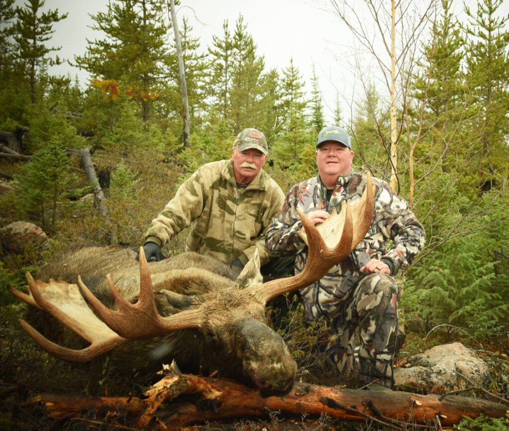 Portrait of Bill and Dave and their moose