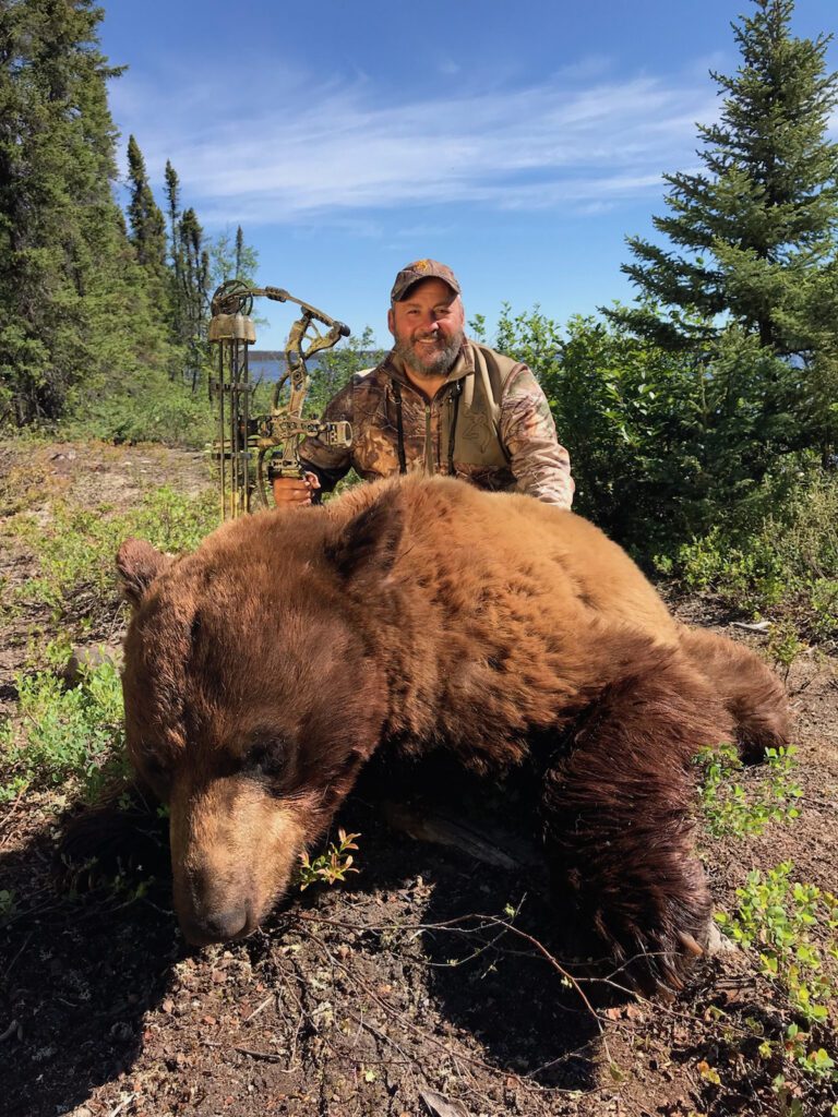Portrait of Ralph Cin and his brown bear