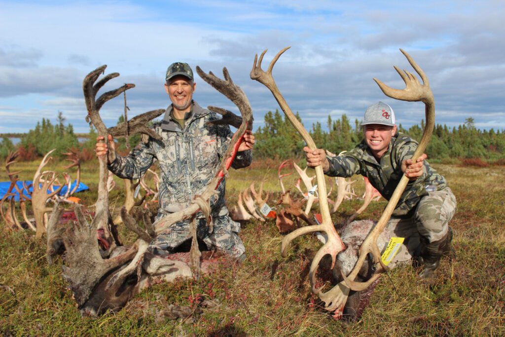 Portrait of Roger Batt and Kassen with their caribou